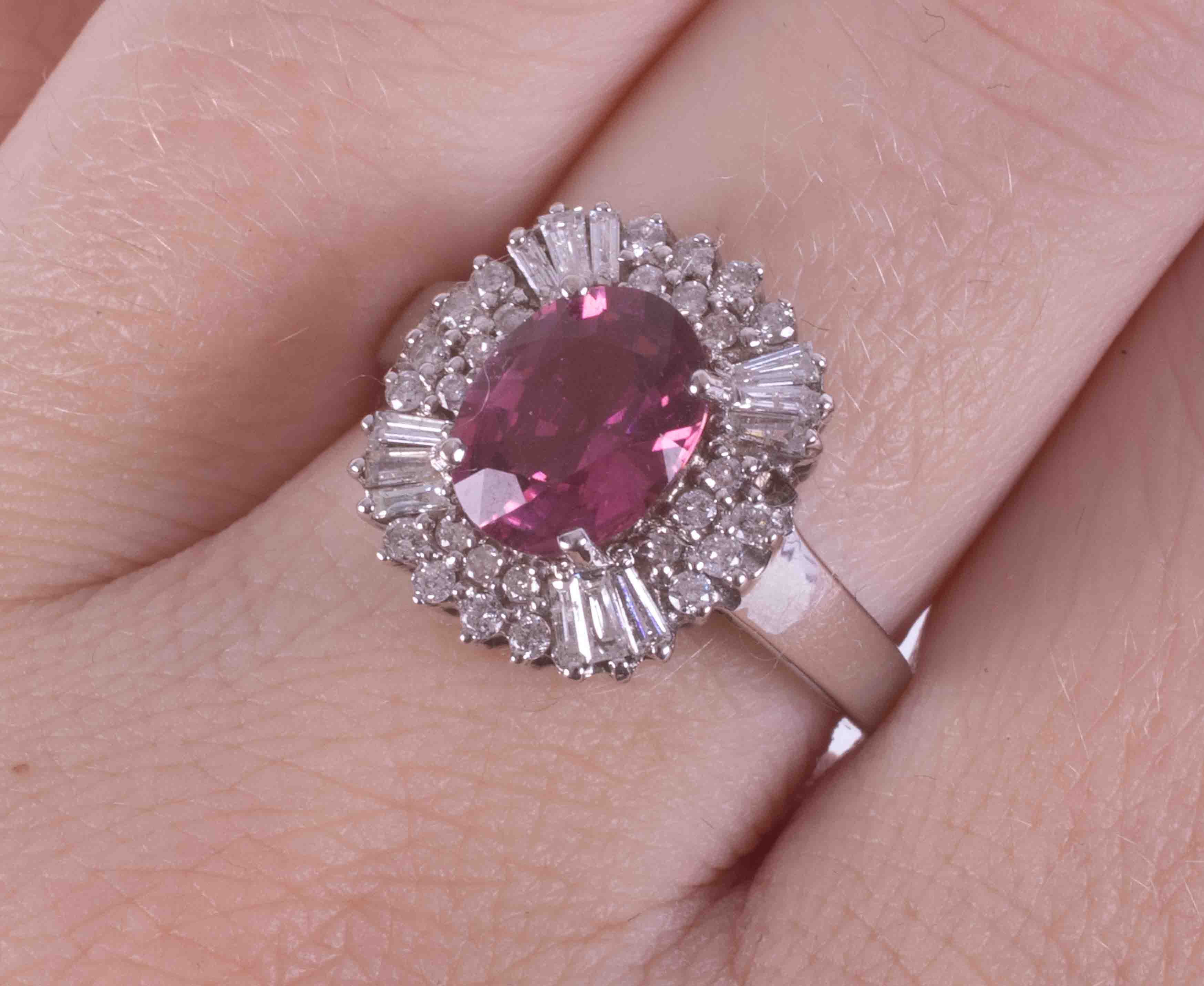 An 18ct white gold cluster ring set with a central oval cut pink tourmaline?, surrounded by - Image 2 of 2