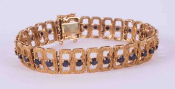 A 9ct yellow gold textured finish open link bracelet set with twenty-nine round cut sapphires,
