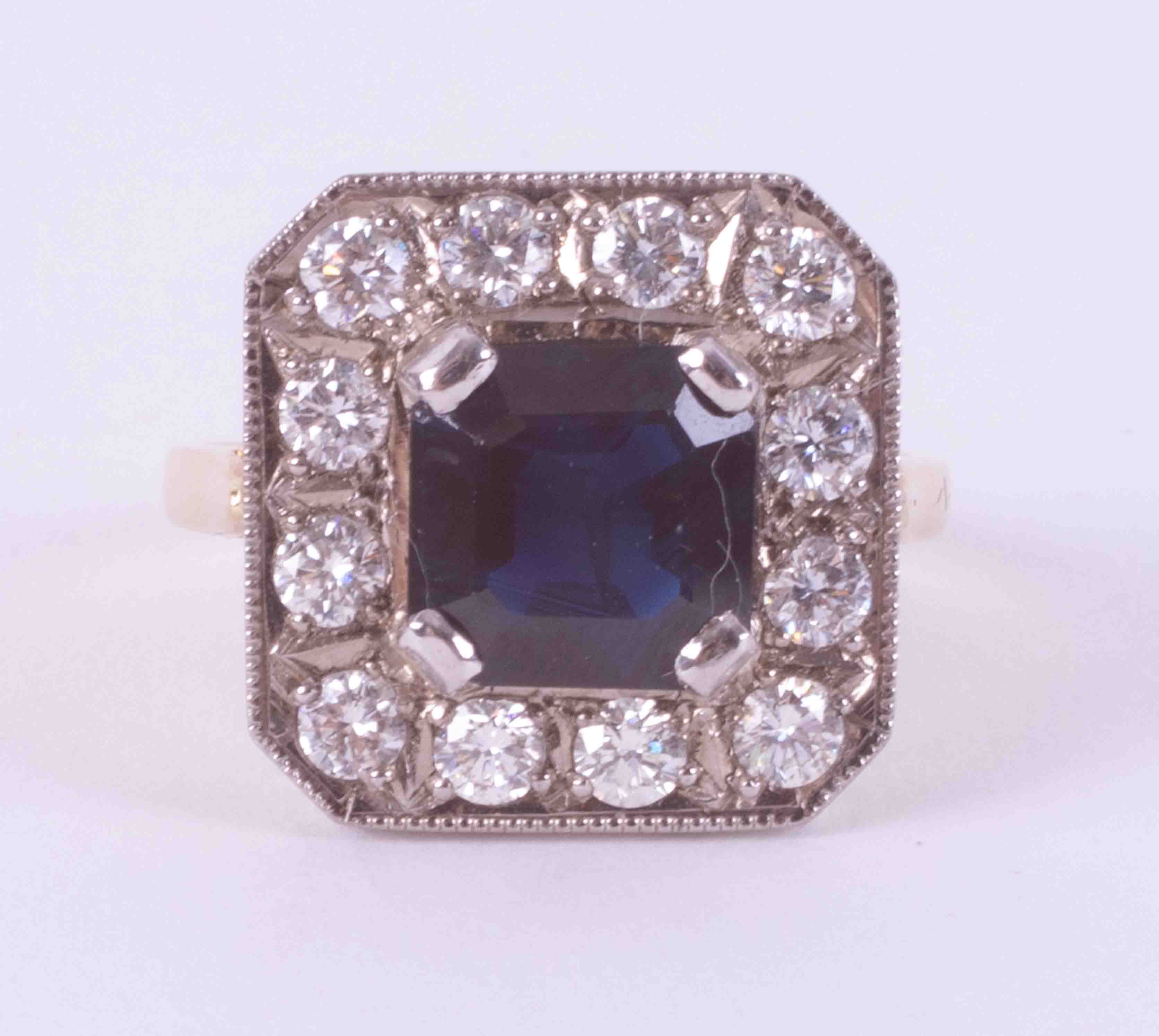 18ct yellow & white gold square shaped cluster ring set with a central square cut sapphire,