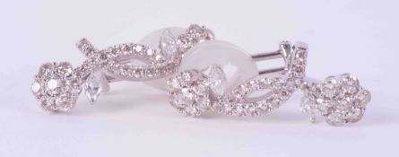 A pair of 18ct white gold double flower earrings set with approx. 3.20 carats total weight of