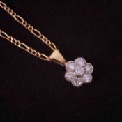 A 9ct yellow gold 26" figaro chain with a yellow & white gold (no hallmarks) flower pendant set with