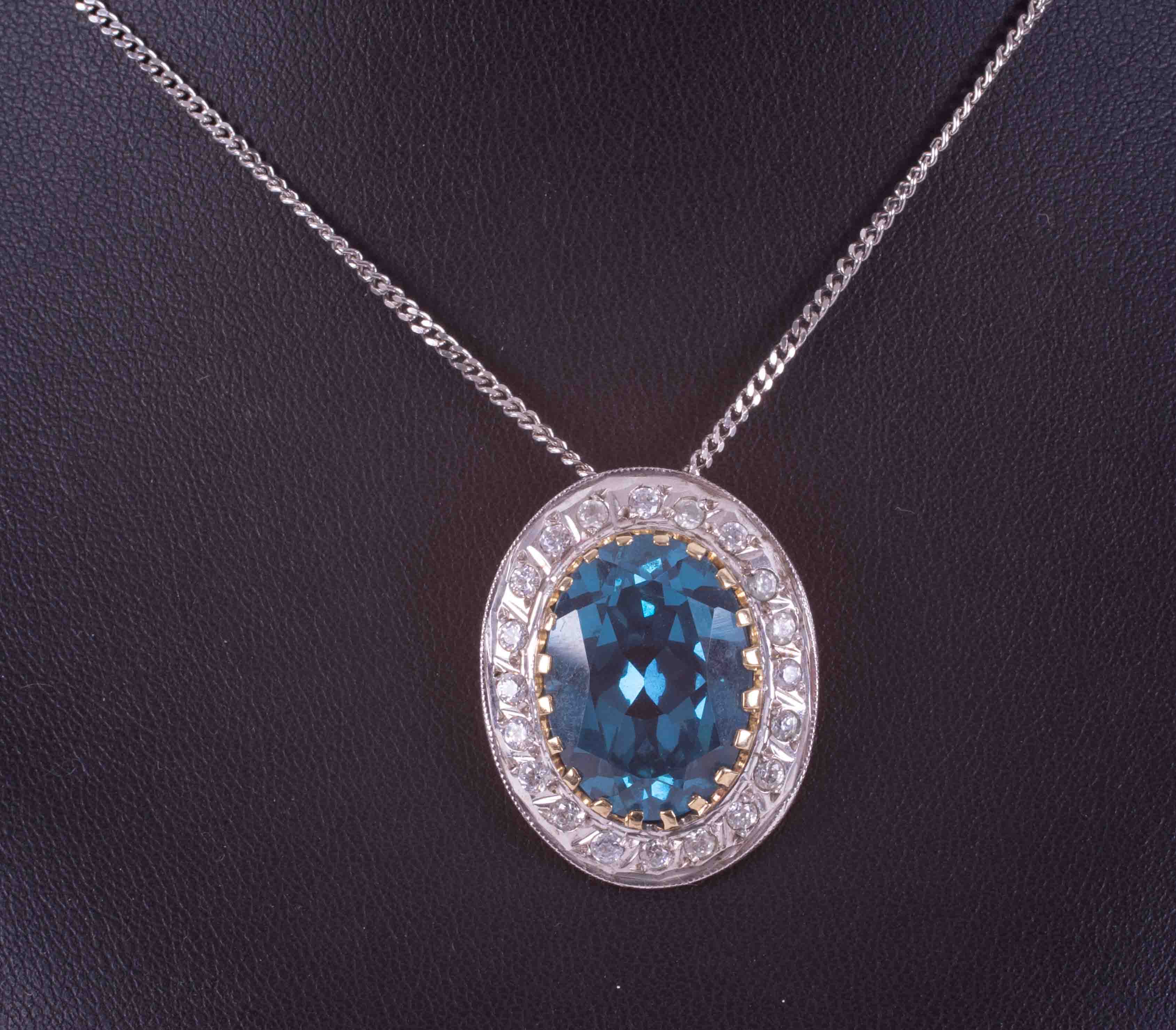 A 9ct white gold 18" curb chain with a 14ct yellow & white gold pendant set with paste blue & - Image 2 of 2