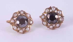 A pair of 18ct yellow gold antique cluster style earrings set with seed pearls and a central faceted