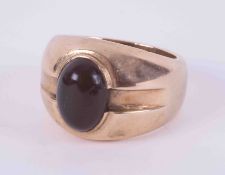 A 9ct yellow gold heavy design gents signet ring set with cabochon cut black onyx, 28.39g, size Z.