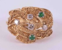 An 18ct yellow gold textured open weave ring set with two round cut emeralds, approx. total weight