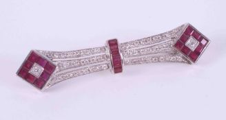 An 18ct white gold Art Deco style bar brooch set with square & emerald cut rubies, total weight