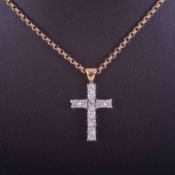 A 9ct yellow gold 16" belcher chain with an 18ct yellow & white gold cross pendant set with