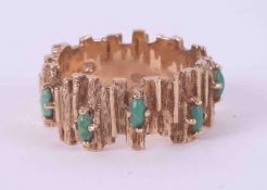 A 9ct yellow gold textured band set with five marquise shaped cabochon cut turquoise stones, 5.