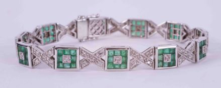 A fine 18ct white gold bracelet set with square cut emeralds and small round brilliant cut diamonds,