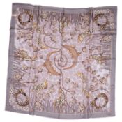 Cartier, a 100% silk Cartier Savann A Motif scarf with animal & gemstone print in a mixture of