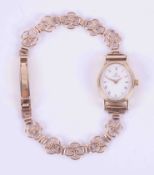 Omega, a vintage ladies quartz 9ct yellow gold Omega dress watch with a white oval face