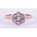 An 18ct yellow & white gold flower cluster ring set with seven old round cut diamonds, approx. total