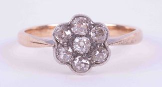 An 18ct yellow & white gold flower cluster ring set with seven old round cut diamonds, approx. total