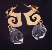 A pair of designer Van Der Straeten drop clip on earrings with gold metal swirl design and heavy