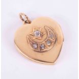 An antique 18ct yellow gold heart locket with a star and moon design set with five old round cut