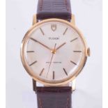 Tudor, a gents gold plated wristwatch on brown leather strap.