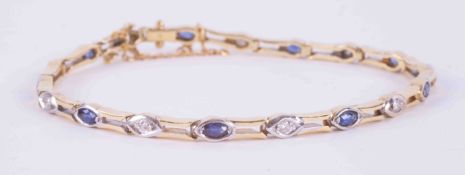 An 18ct yellow & white gold link bracelet set with 9 marquise cut sapphires approx. 0.58 carats in