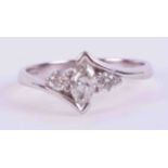 An 18ct white gold cross over style ring set with a central marquise cut diamond, approx. 0.27