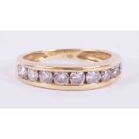 An 18ct yellow gold half eternity ring channel set with approx. 1.00 carats total weight of round