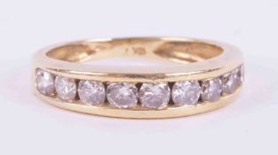 An 18ct yellow gold half eternity ring channel set with approx. 1.00 carats total weight of round
