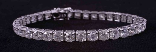 A fine 18ct white gold line bracelet set with 36 round brilliant cut diamonds, total weight of