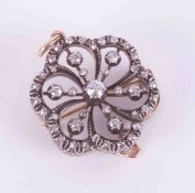 An antique Victorian diamond set flower brooch/pendant set with round old cut diamonds, 7.59g,