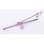 A 9ct rose gold bar brooch set with an oval amethyst approx. 0.60 carats in size, with safety chain,