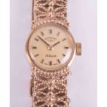 Rotary, a ladies vintage 9ct yellow gold wristwatch with a fancy link bracelet with a semi-hidden