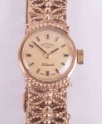 Rotary, a ladies vintage 9ct yellow gold wristwatch with a fancy link bracelet with a semi-hidden