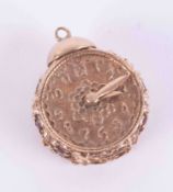 An ornate 9ct yellow gold clock charm/pendant? with six round cut garnets set to the sides, 8.29g,