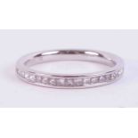 A platinum half eternity ring set with approx. 0.30 carats of princess cut diamonds, colour G-H