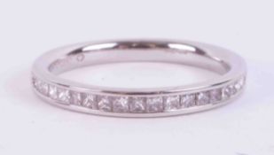 A platinum half eternity ring set with approx. 0.30 carats of princess cut diamonds, colour G-H