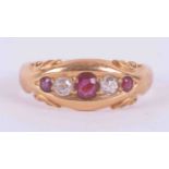 An 18ct yellow gold gypsy style ring set with three round cut rubies, total weight approx. 0.16