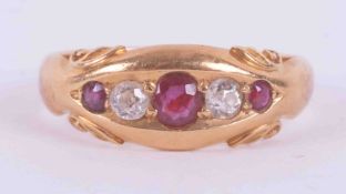 An 18ct yellow gold gypsy style ring set with three round cut rubies, total weight approx. 0.16