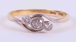 An 18ct yellow gold & platinum three stone twist style ring set with three old round cut diamonds,