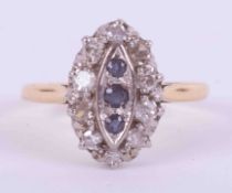 An 18ct yellow & white gold marquise shaped cluster ring set with three small round cut sapphires