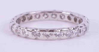 A platinum full eternity band set with approx. 0.90 carats of round brilliant cut diamonds, colour