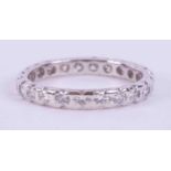 A platinum full eternity band set with approx. 0.90 carats of round brilliant cut diamonds, colour