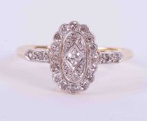 An 18ct yellow gold & platinum antique oval cluster style ring set with old round cut diamonds,