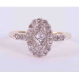 An 18ct yellow gold & platinum antique oval cluster style ring set with old round cut diamonds,