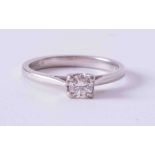 A modern platinum four claw ring set 0.25 carat round brilliant cut diamond, colour G-H, SI clarity,