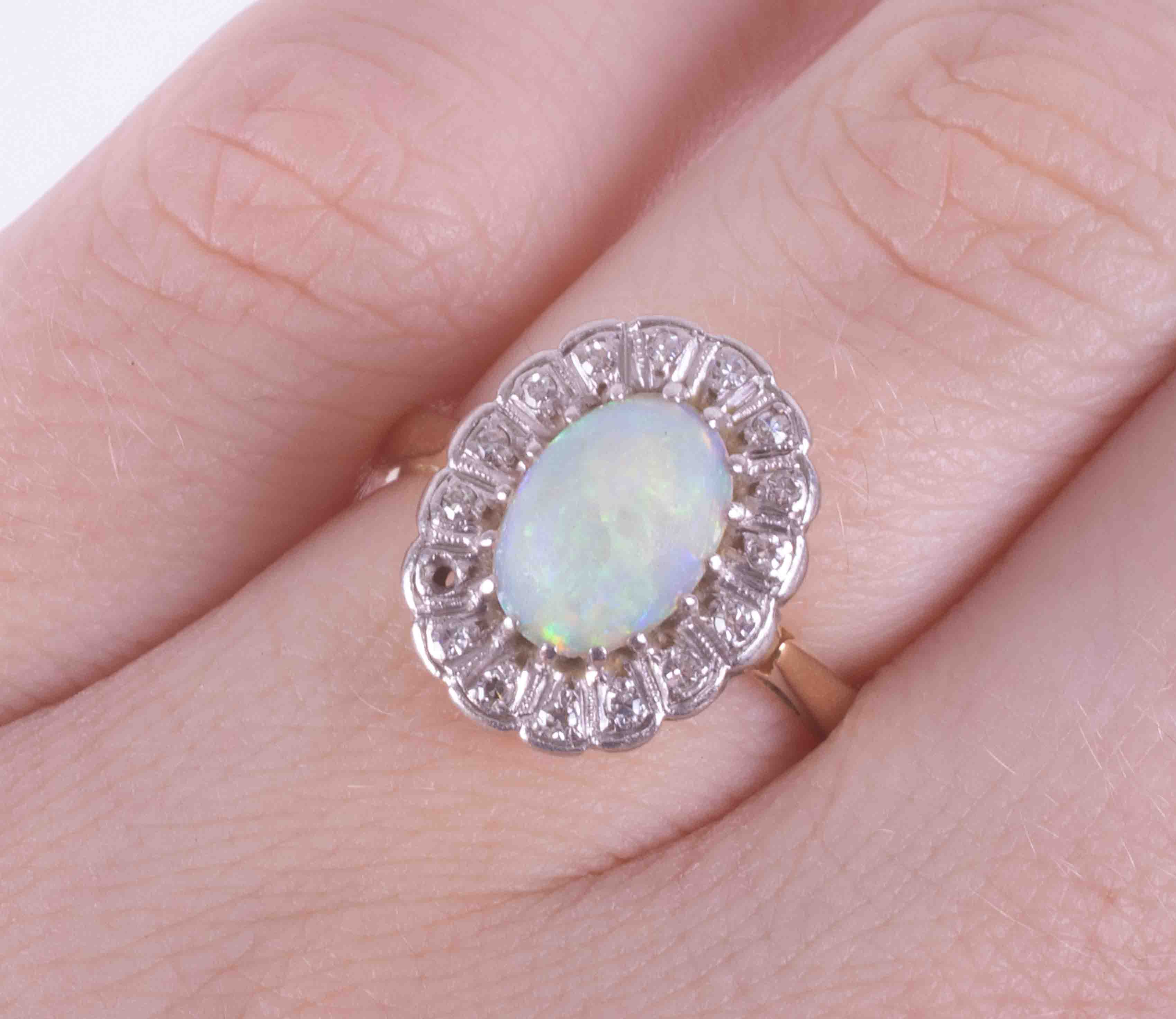 An 18ct yellow gold cluster ring set with a cabochon cut white opal, measuring approx. 9mm x 7mm, - Image 2 of 2