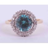 An 18ct yellow gold & platinum cluster ring set with approx. 1.67 carats of blue zircon surrounded