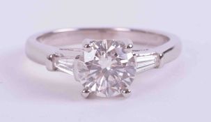 An 18ct white gold ring set with a round brilliant cut diamond, approx. 1.18 carats, with a