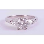 An 18ct white gold ring set with a round brilliant cut diamond, approx. 1.18 carats, with a