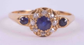 An antique 18ct yellow gold cluster style ring set with 3 round cut sapphires, total weight