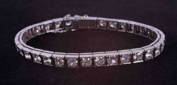 An antique platinum line bracelet set with 34 round cut diamonds, total approx. weight 6.00