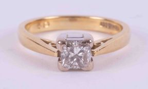 An 18ct yellow & white gold ring set with 0.50 carats of princess cut diamond, colour H-I and SI2