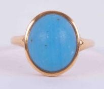 An 18ct yellow gold ring set with an oval cabochon cut turquoise measuring approx. 12.7mm x 11mm,