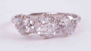 An impressive 18ct white & yellow gold three stone ring set with approx. 3.37 carats total weight of